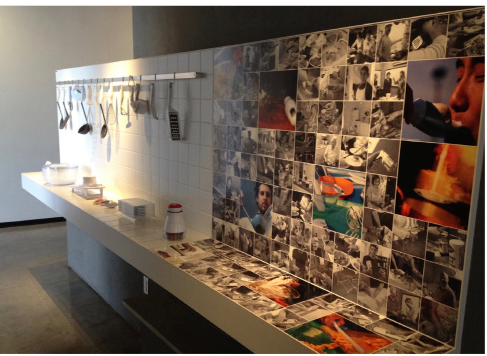An installation at IDEO headquarters showing research photos and finished products